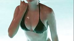 Maia Mitchell emerging from a pool in a black bikini